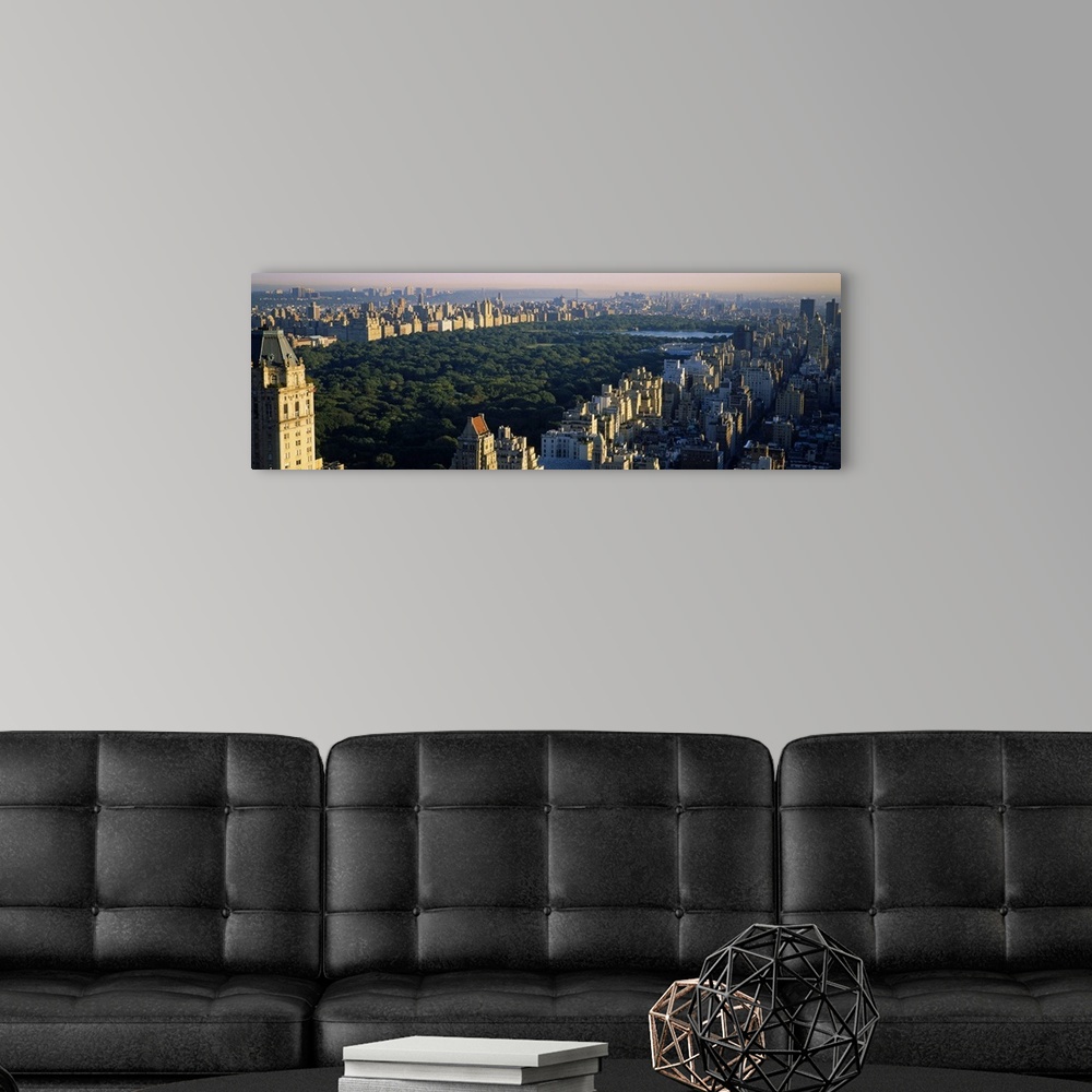 A modern room featuring Panoramic canvas photo of the trees and lake in Central Park surrounded by the buildings of the c...