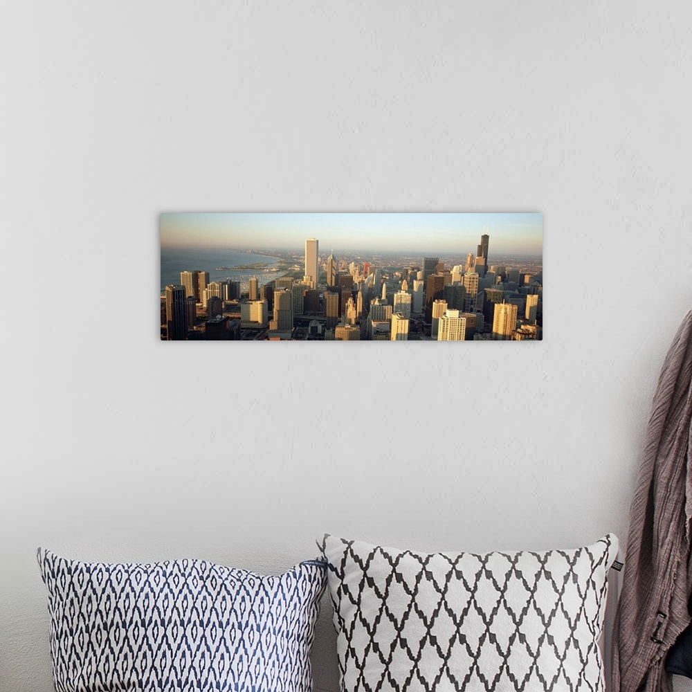 A bohemian room featuring This panoramic canvas is an aerial photograph of the city skyline.