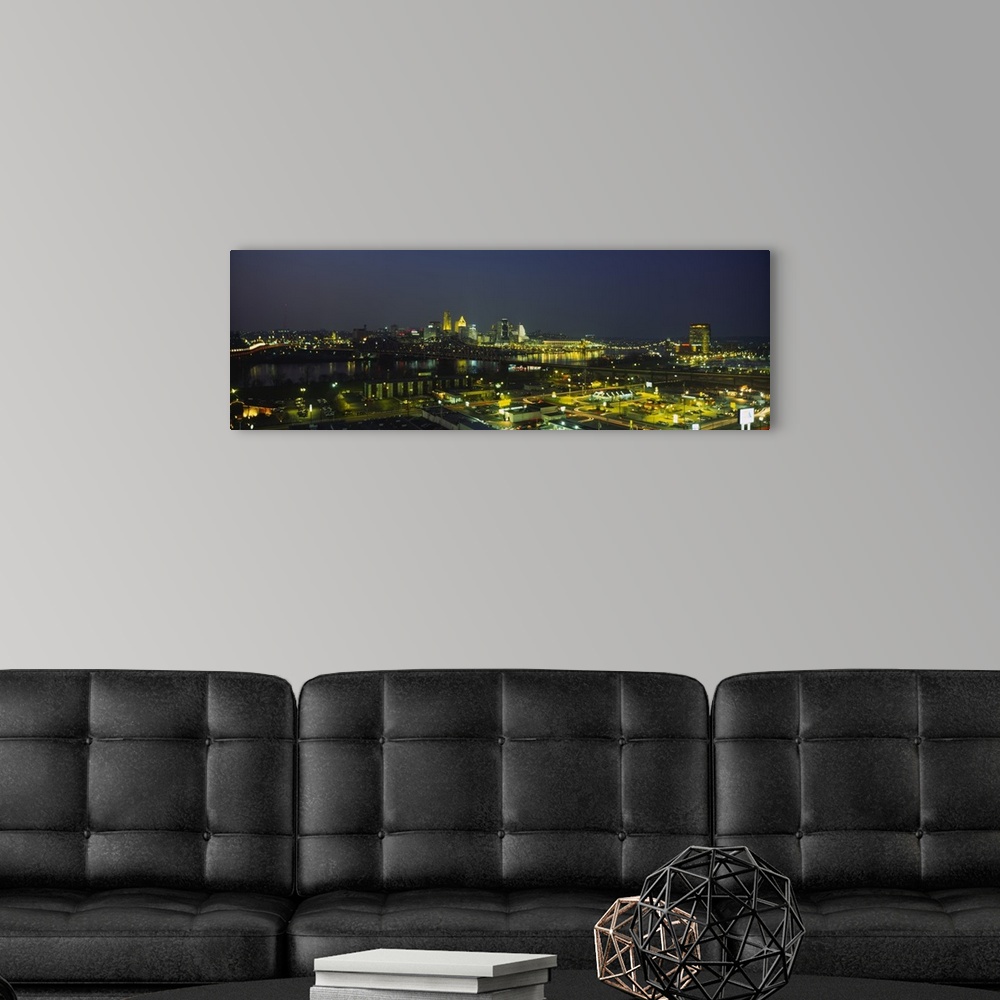 A modern room featuring High angle view of buildings in a city lit up at night, Cincinnati, Ohio