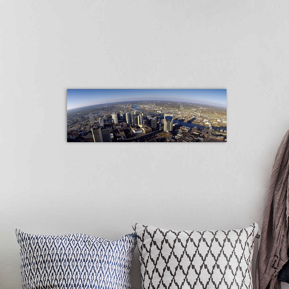 A bohemian room featuring An aerial photograph taken in panoramic view of the city of Nashville during the day.