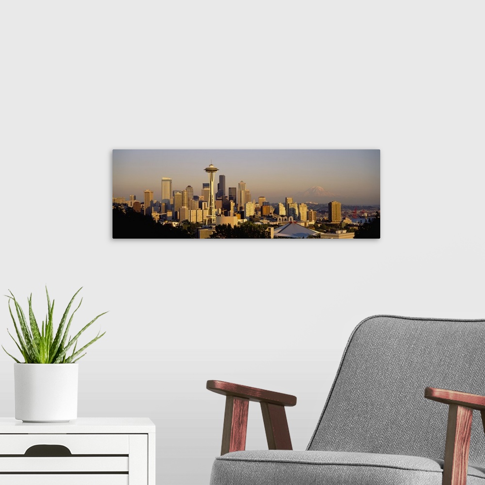 A modern room featuring Big, horizontal, high angle photograph of the Seattle skyline, Mount Rainier is slightly visible ...