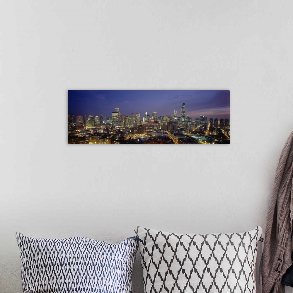 A bohemian room featuring Panoramic photograph taken of downtown Chicago during the night with all the building windows ill...
