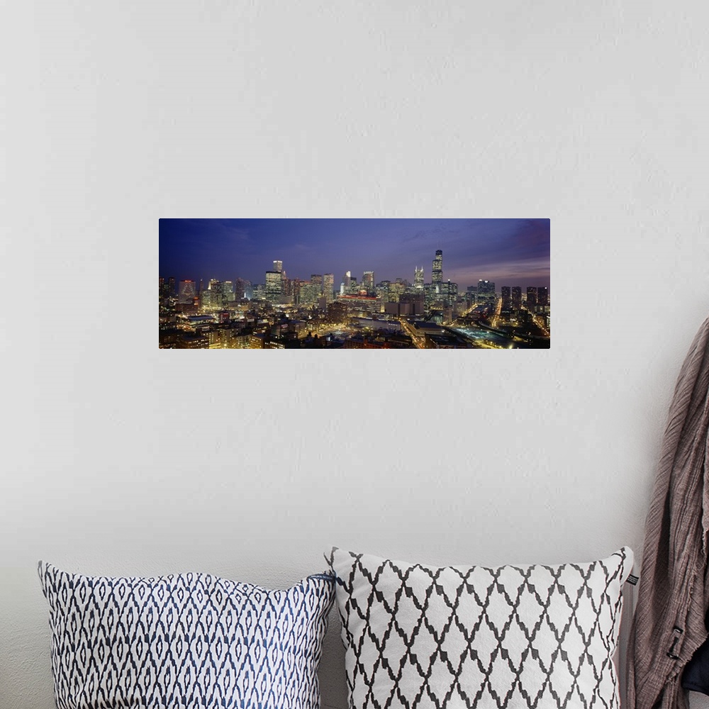 A bohemian room featuring Panoramic photograph taken of downtown Chicago during the night with all the building windows ill...