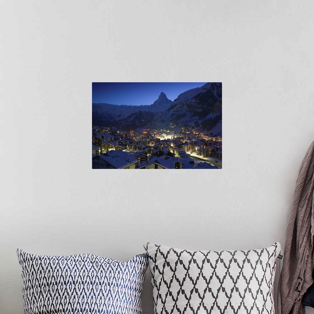 A bohemian room featuring Photograph of city from above at night with snow covered foothills in the distance.
