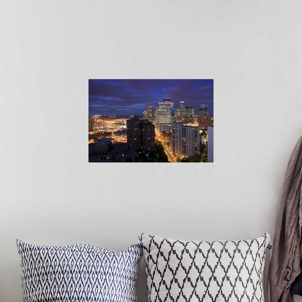 A bohemian room featuring This photograph is taken of downtown Minneapolis at night from atop a building and looking straig...