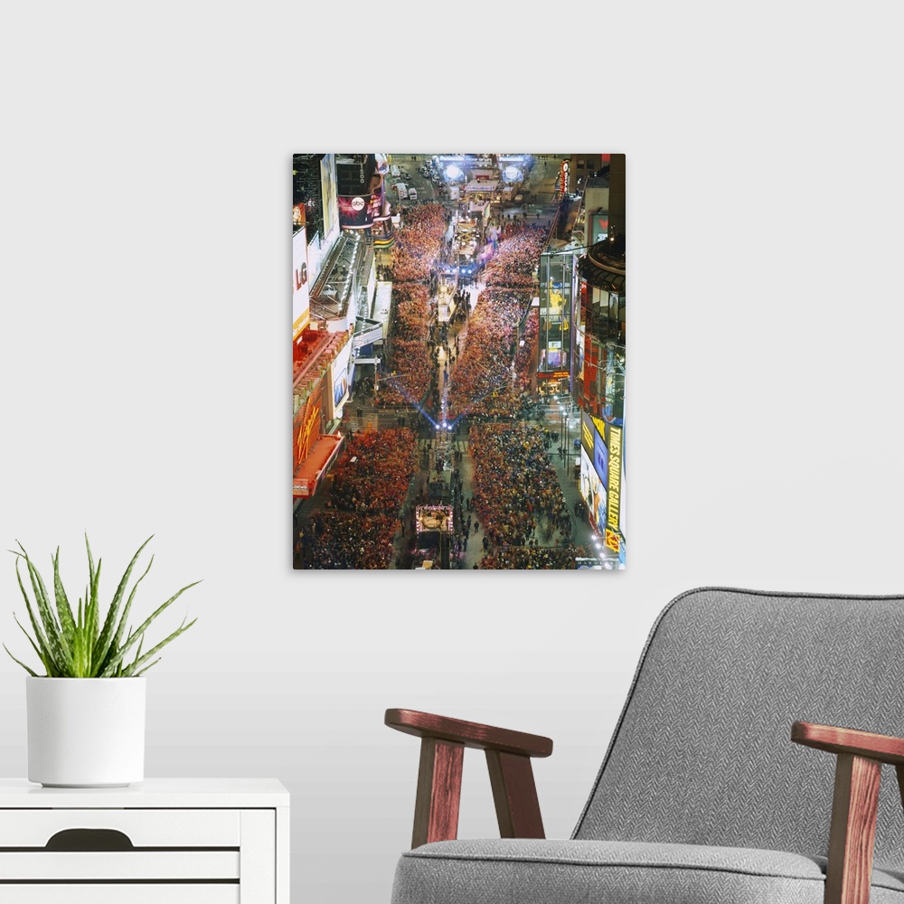 A modern room featuring Photograph of iconic city block in the ""Big Apple"" and night that is crowded with people waitin...