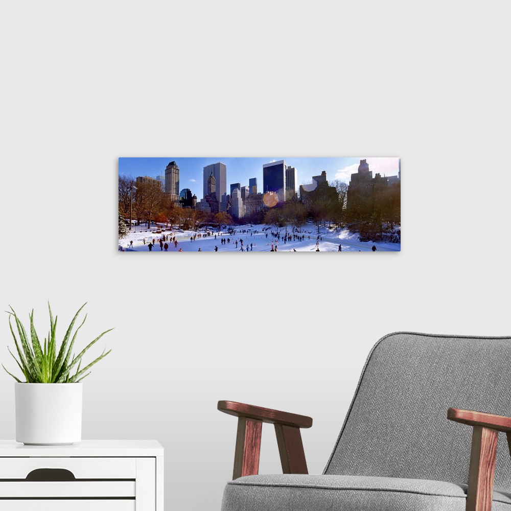 A modern room featuring High angle view of people skating in an ice rink, Wollman Rink, Central Park, Manhattan, New York...
