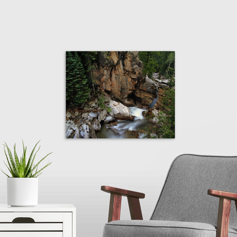 A modern room featuring Aerial photo of the mountains and forest surrounding the Roaring Fork River in White River Nation...