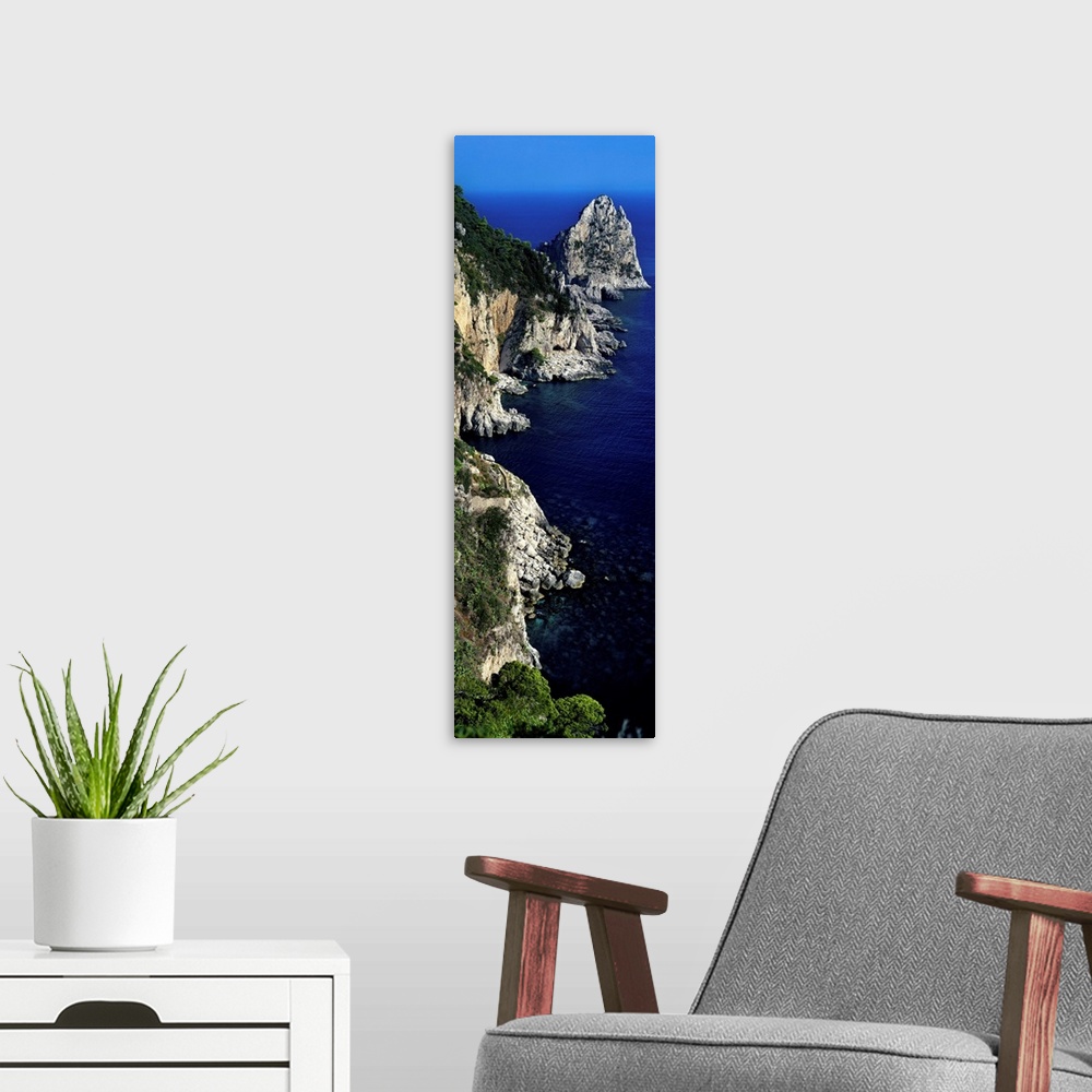 A modern room featuring High angle view of rock formations on the coast, Faraglioni, Capri, Italy