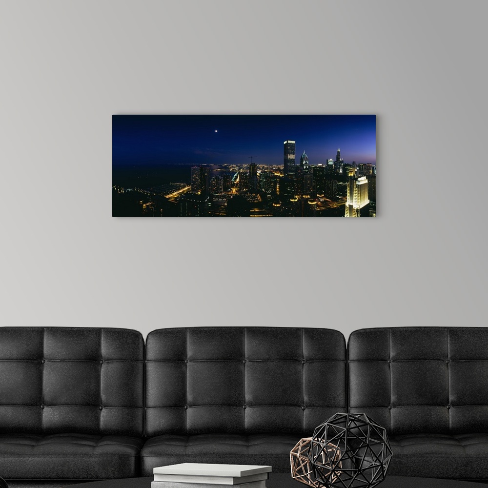A modern room featuring High angle view of skyscrapers lit up at night, Chicago, Illinois