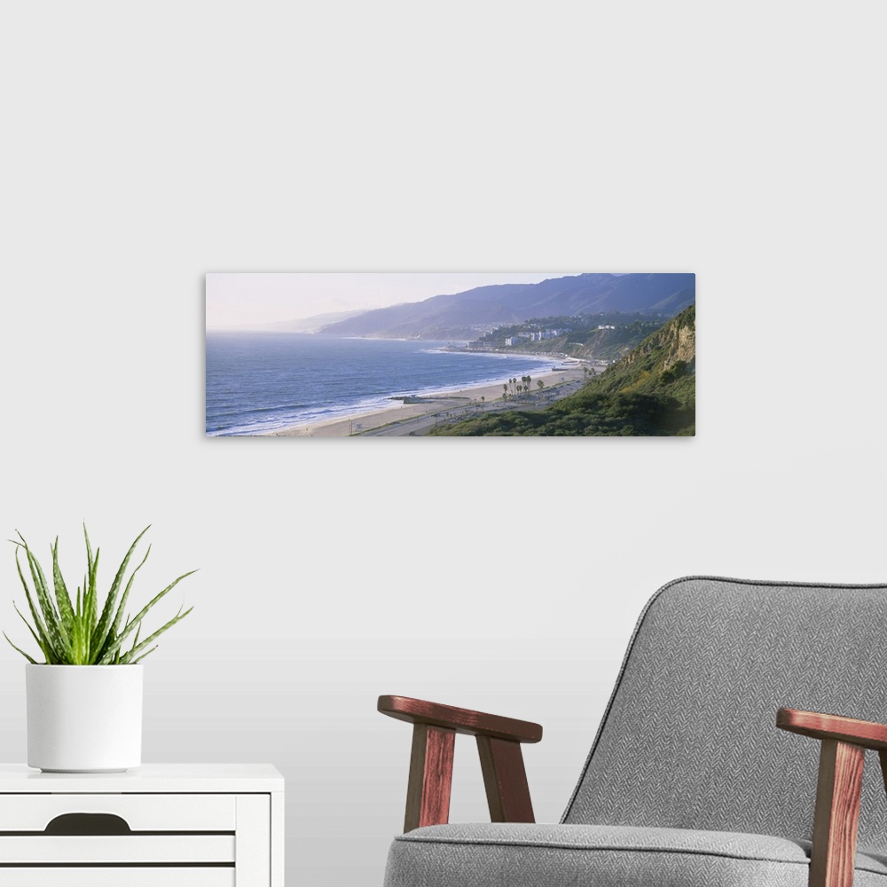 A modern room featuring Panorama of sandy shoreline on the West Coast with the hillside fading in to the early morning fog.