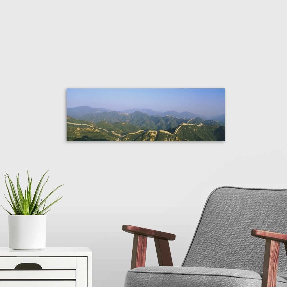 A modern room featuring High angle panorama of the mountains and the Great Wall of China.