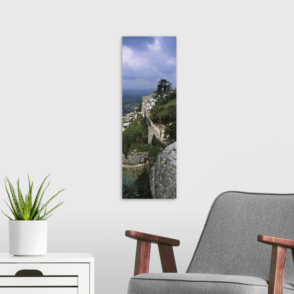 A modern room featuring High angle view of the old ruins of a castle, Castelo Dos Mouros, Sintra, Estremadura, Portugal