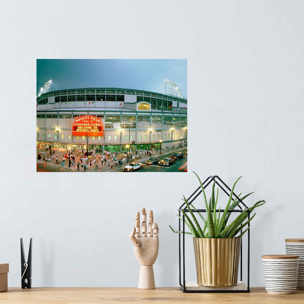 A bohemian room featuring A horizontal photograph showing an entrance and sign to Chicagoos beloved baseball stadium.