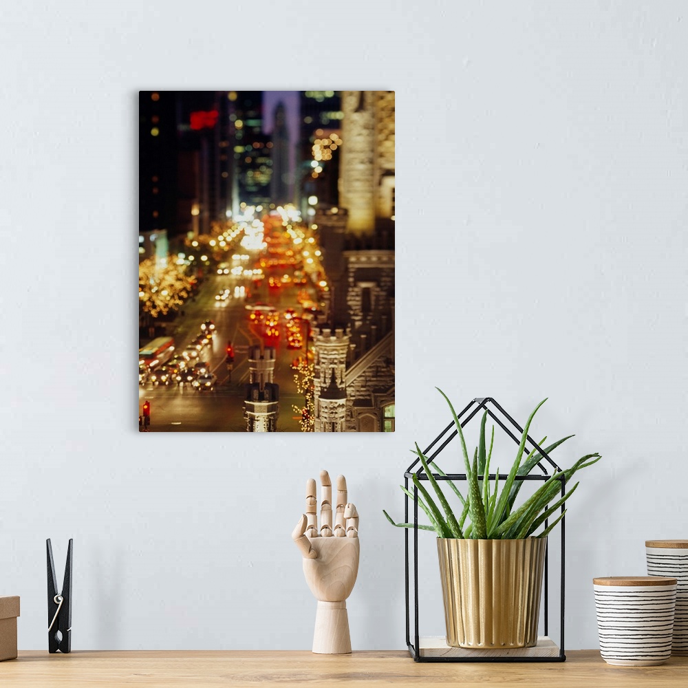 A bohemian room featuring Vertical panoramic photograph of busy street lined with tall buildings that are lit up in the nig...