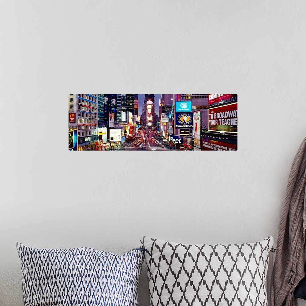 A bohemian room featuring Panoramic photograph of neon signs and city streets downtown.