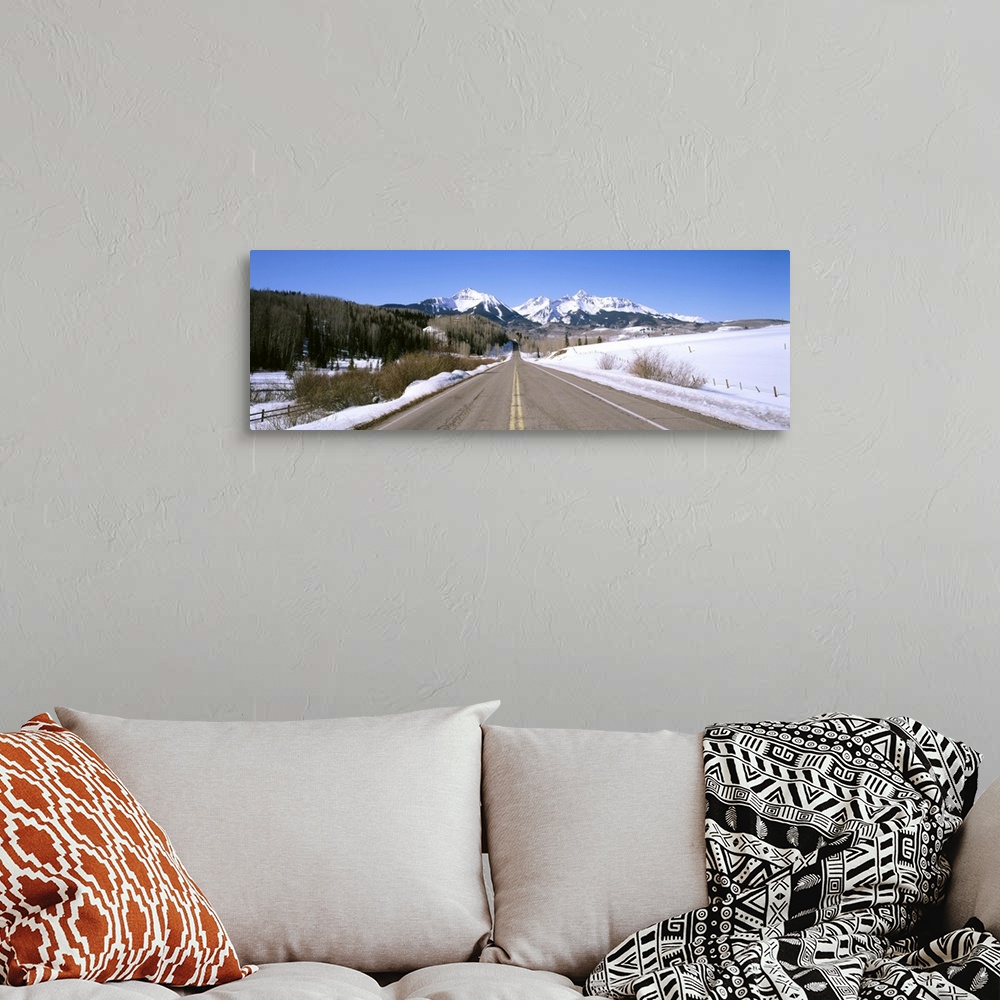 A bohemian room featuring Highway in front of snowcapped mountains, Telluride, Colorado