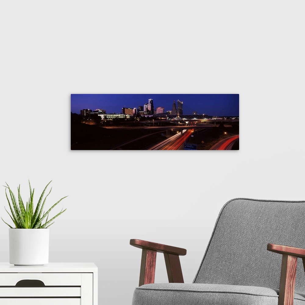 A modern room featuring Highway interchange and skyline at dusk, Kansas City, Missouri, USA