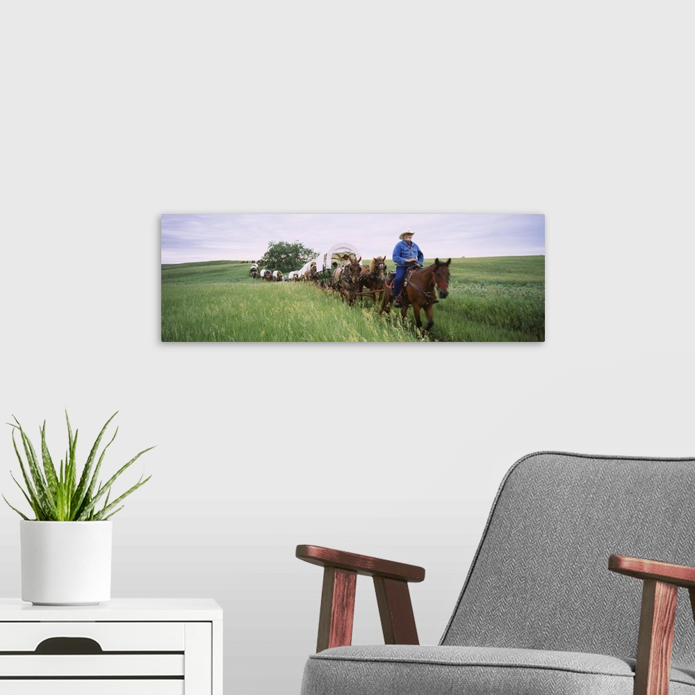 A modern room featuring Historical reenactment of covered wagons in a field, North Dakota