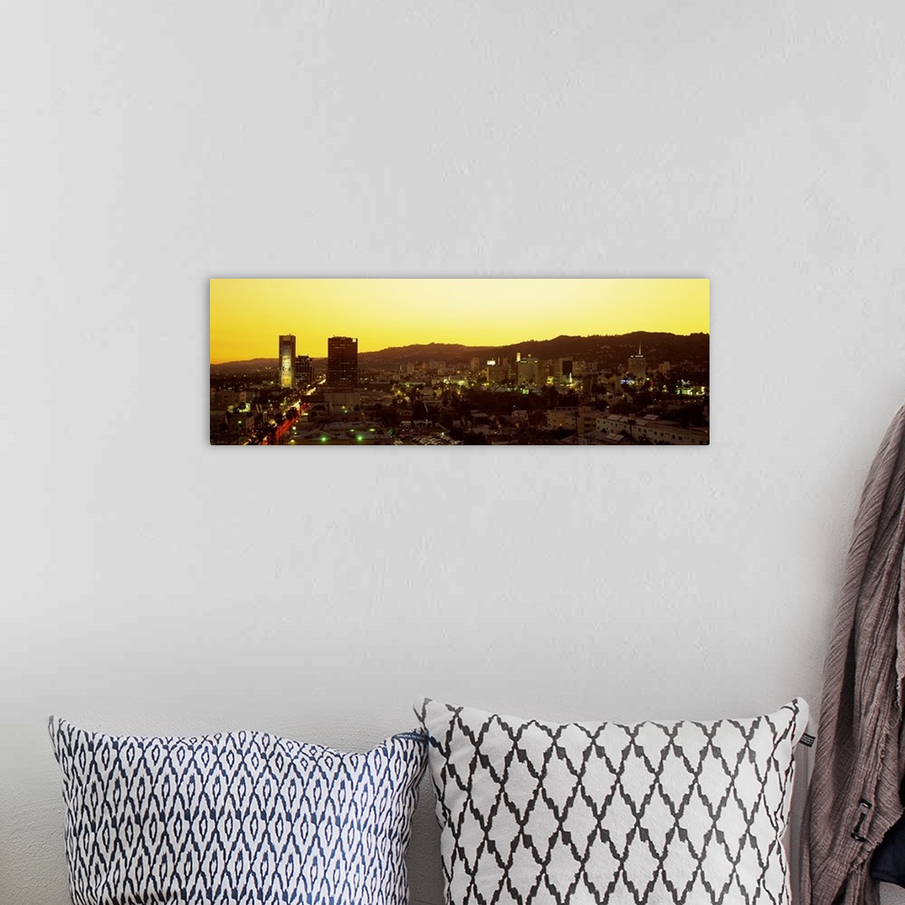 A bohemian room featuring Oversized, high angle photograph of the Hollywood Hills, lit up at sunset, in Hollywood California.