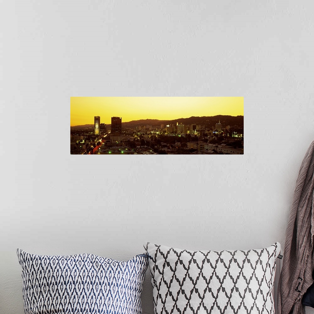 A bohemian room featuring Oversized, high angle photograph of the Hollywood Hills, lit up at sunset, in Hollywood California.
