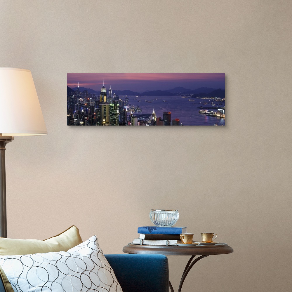 A traditional room featuring Panoramic image of twilight and the Hong Kong skyline and water by the city.