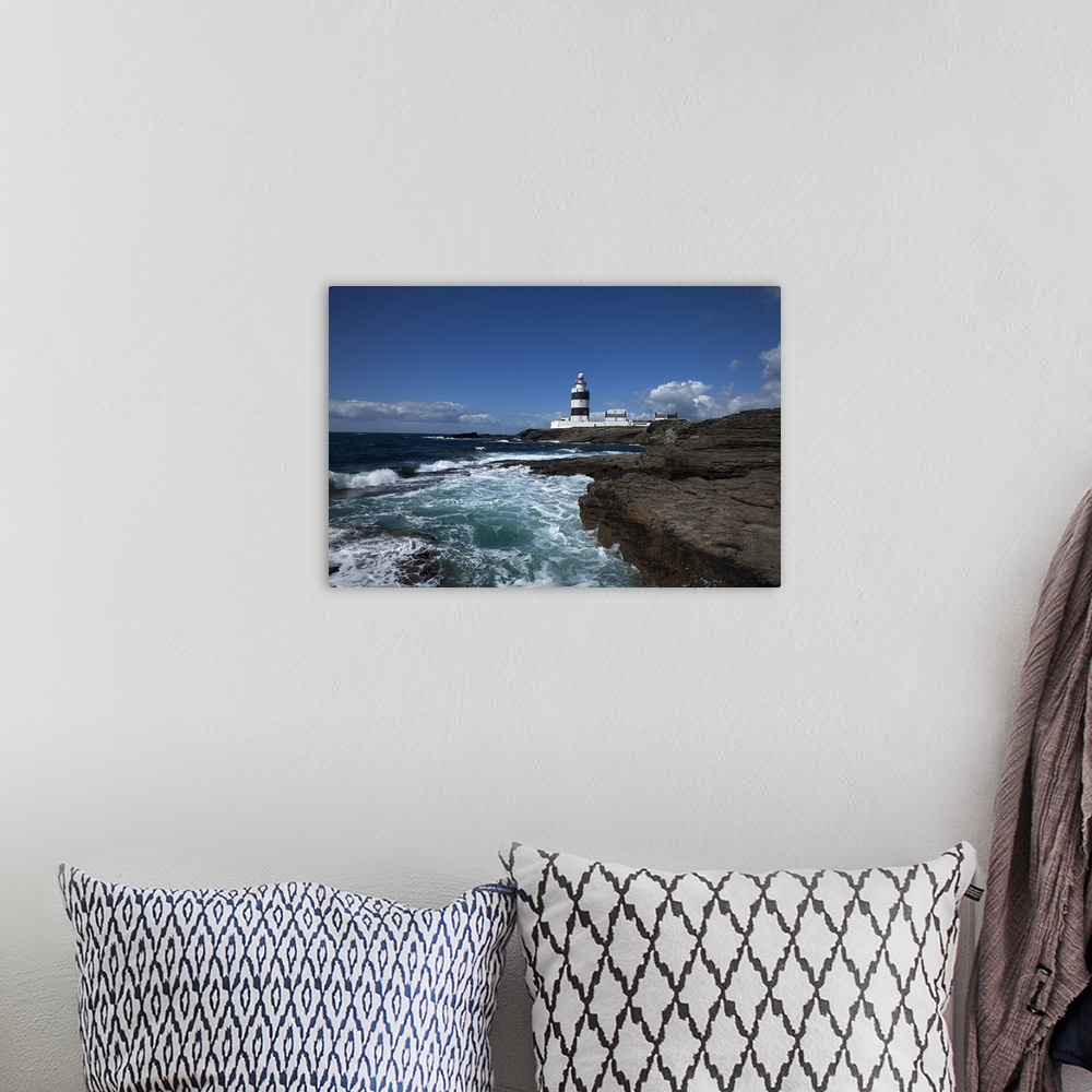 A bohemian room featuring Landscape photograph on a giant canvas of waves crashing into the rocky shoreline in County Wexfo...