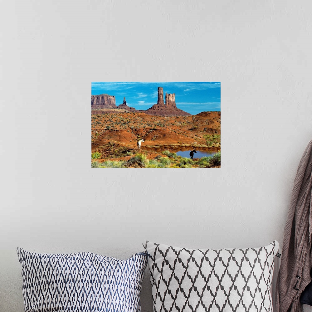 A bohemian room featuring Photograph of Monument Valley in Colorado featuring clusters of sandstone buttes, rocky plateaus,...