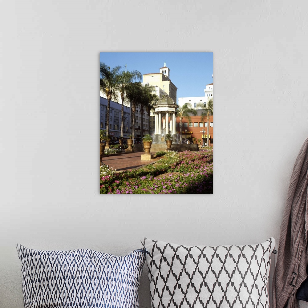 A bohemian room featuring San Diego, California's Horton Plaza with flowers and palm trees.