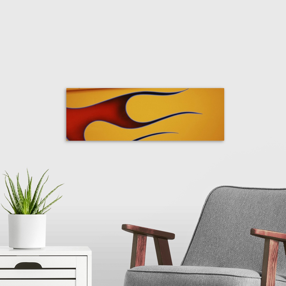 A modern room featuring Hot rod car with flame design