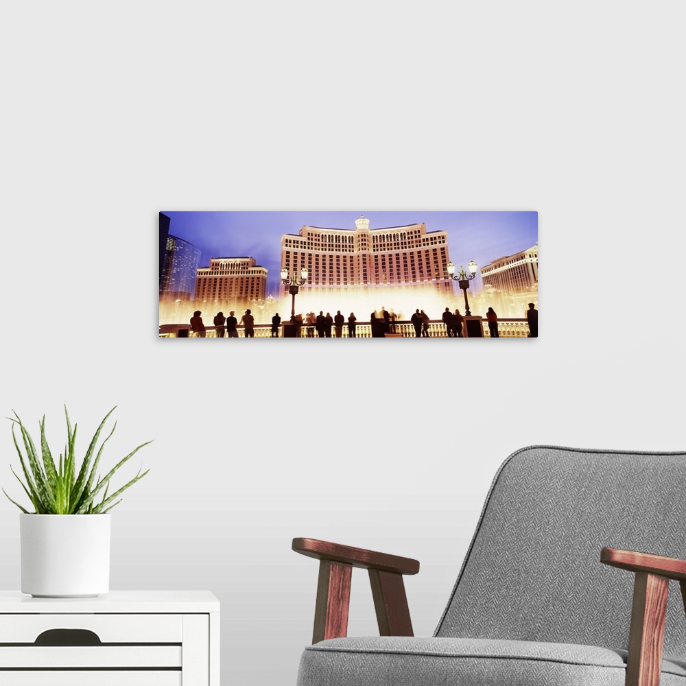 A modern room featuring Large horizontal panoramic photograph of the Bellagio Resort and Casino lit up on the Las Vegas, ...