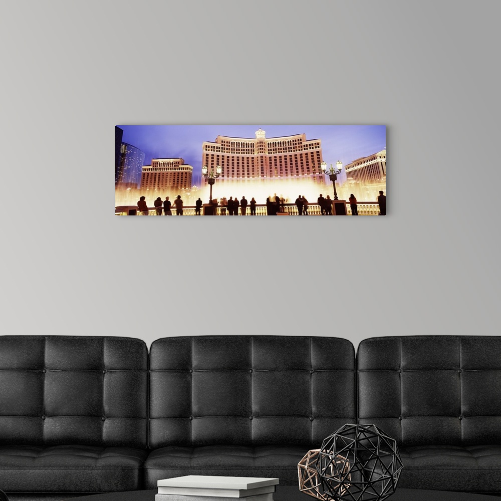 A modern room featuring Large horizontal panoramic photograph of the Bellagio Resort and Casino lit up on the Las Vegas, ...