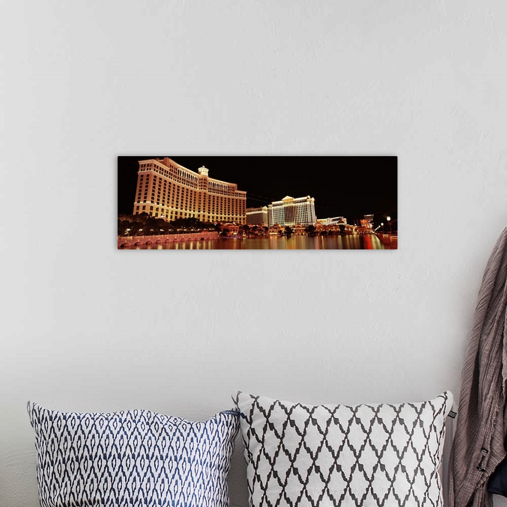 A bohemian room featuring Panoramic photograph of iconic hotel and gambling establishment in ""Sin City.""  The buildings a...