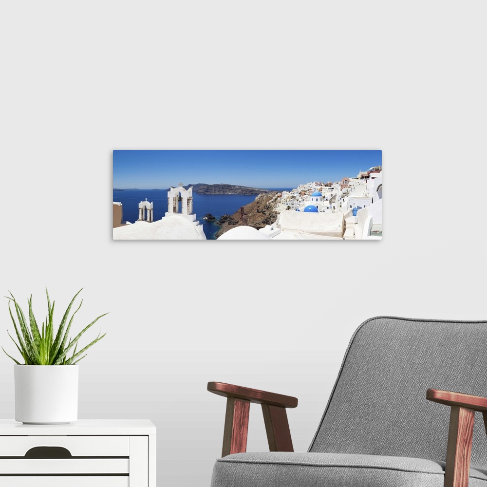 A modern room featuring Houses on a hill, Oia, Santorini, Cyclades Islands, Greece