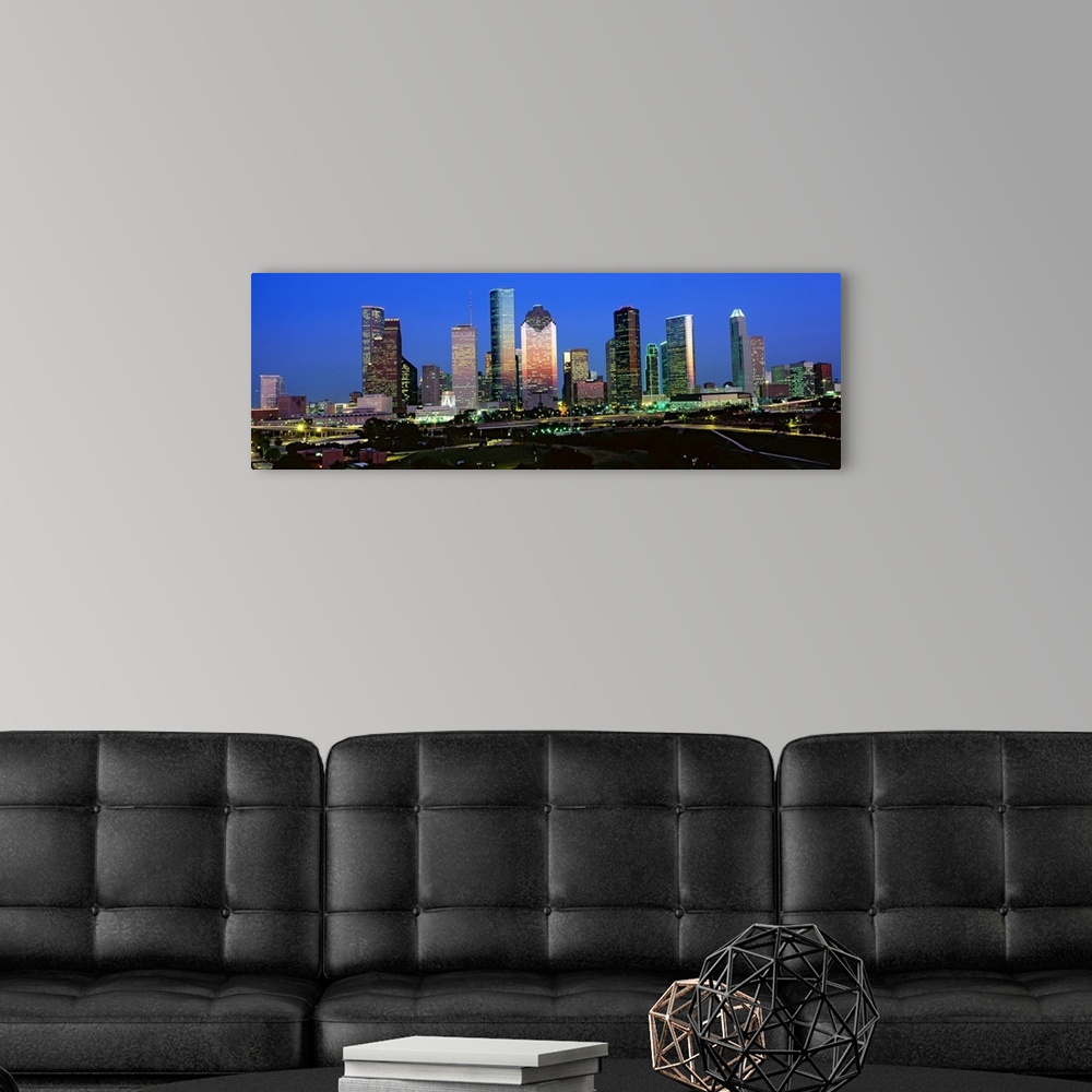 A modern room featuring Decorative artwork for the home or office this photograph captures the city skyline and surrounde...