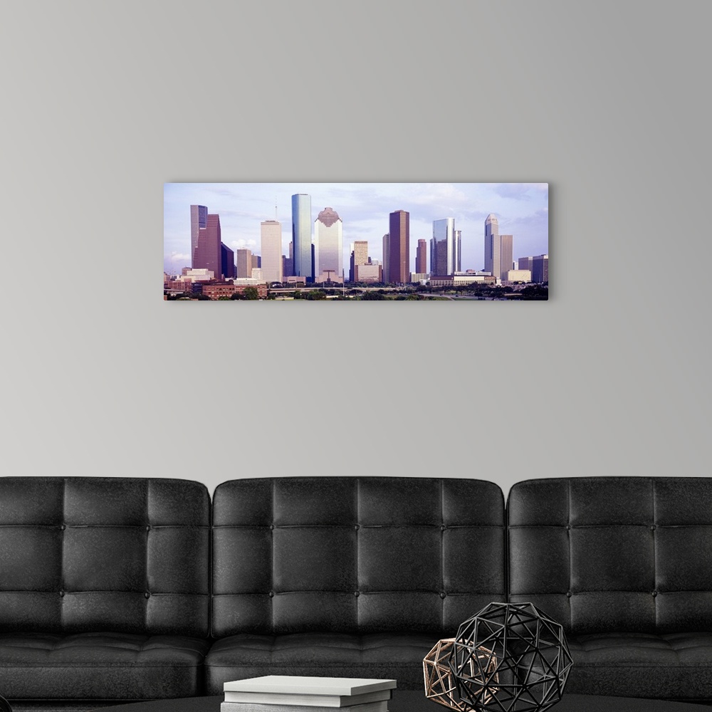 A modern room featuring Panoramic photograph of skyline with park in the foreground.