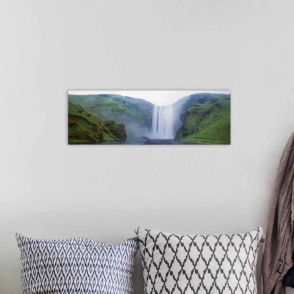 A bohemian room featuring Iceland, Skogar, Skogafoss Waterfall, Panoramic view of a waterfall