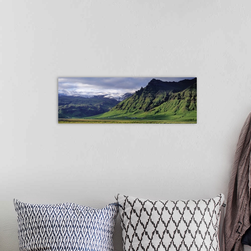 A bohemian room featuring Iceland, South Coast, Sheer Basalt Cliffs, View of farm and cliff in the south coast