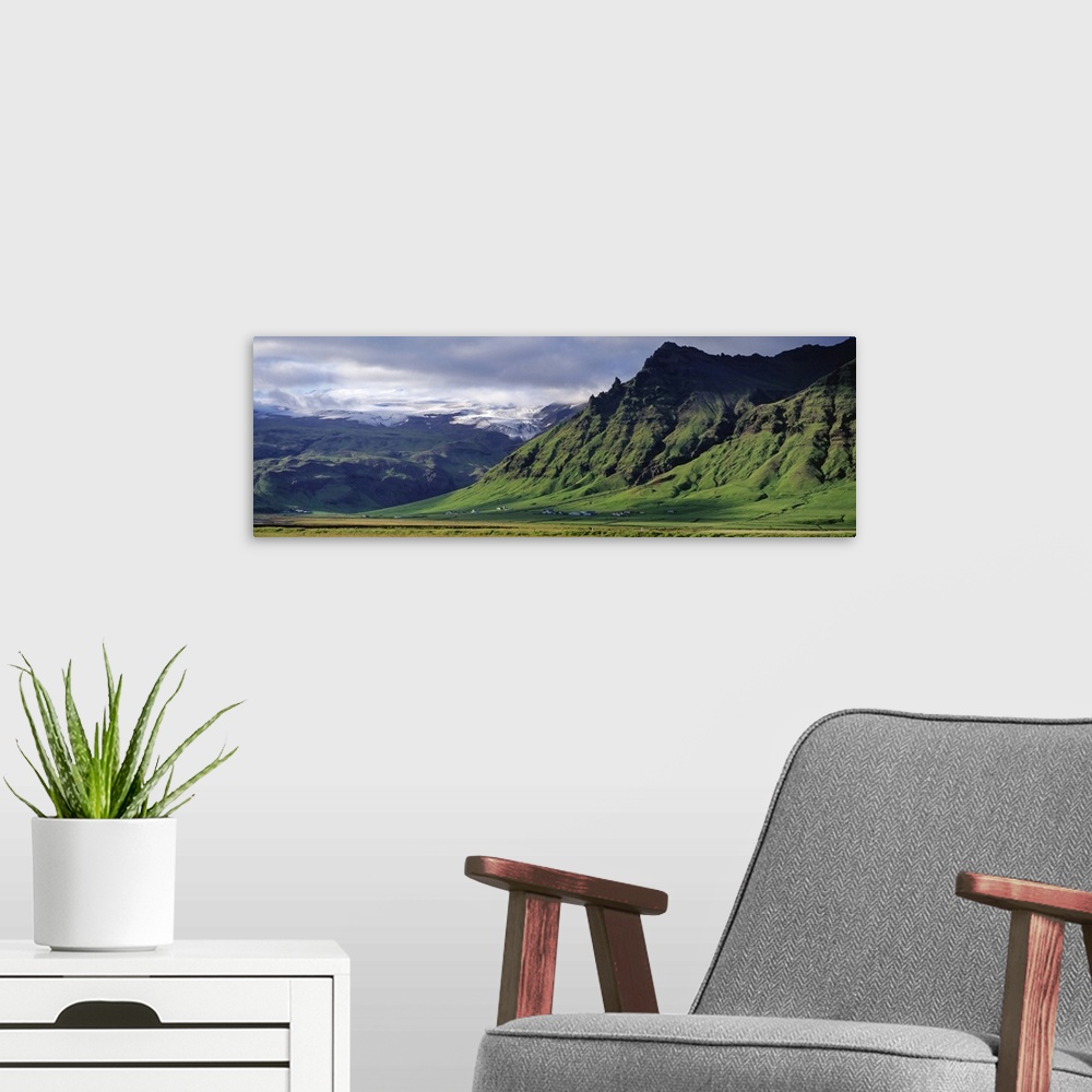A modern room featuring Iceland, South Coast, Sheer Basalt Cliffs, View of farm and cliff in the south coast