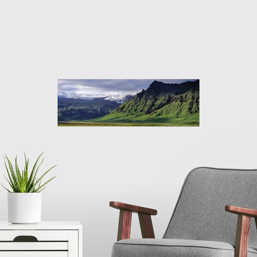 A modern room featuring Iceland, South Coast, Sheer Basalt Cliffs, View of farm and cliff in the south coast