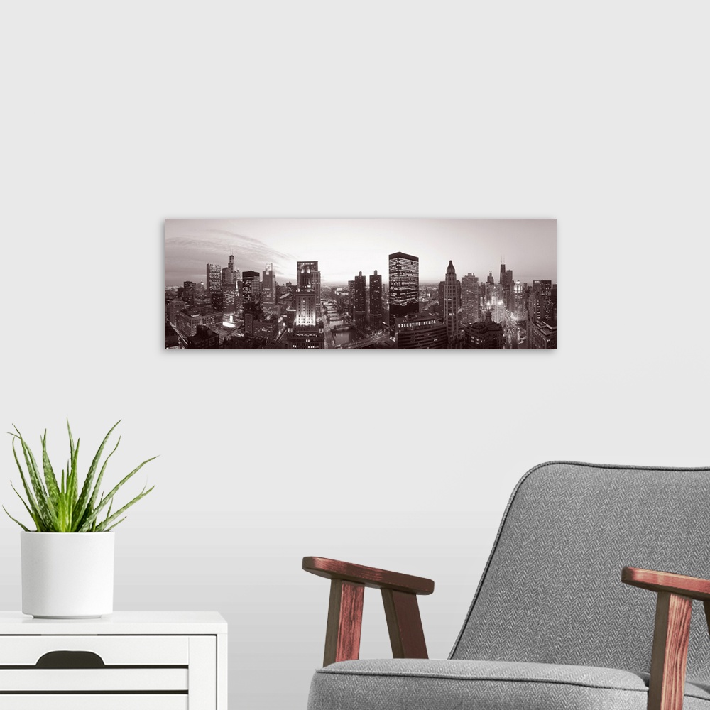 A modern room featuring This wide angle panoramic photograph shows this Midwestern city skyline in a monochromatic tint.