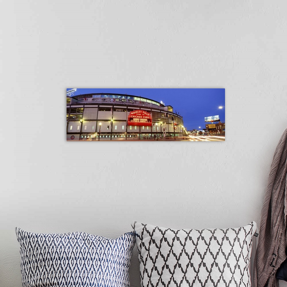 A bohemian room featuring Panoramic photograph displays a nighttime view of the famous marquee sitting outside Wrigley Fiel...