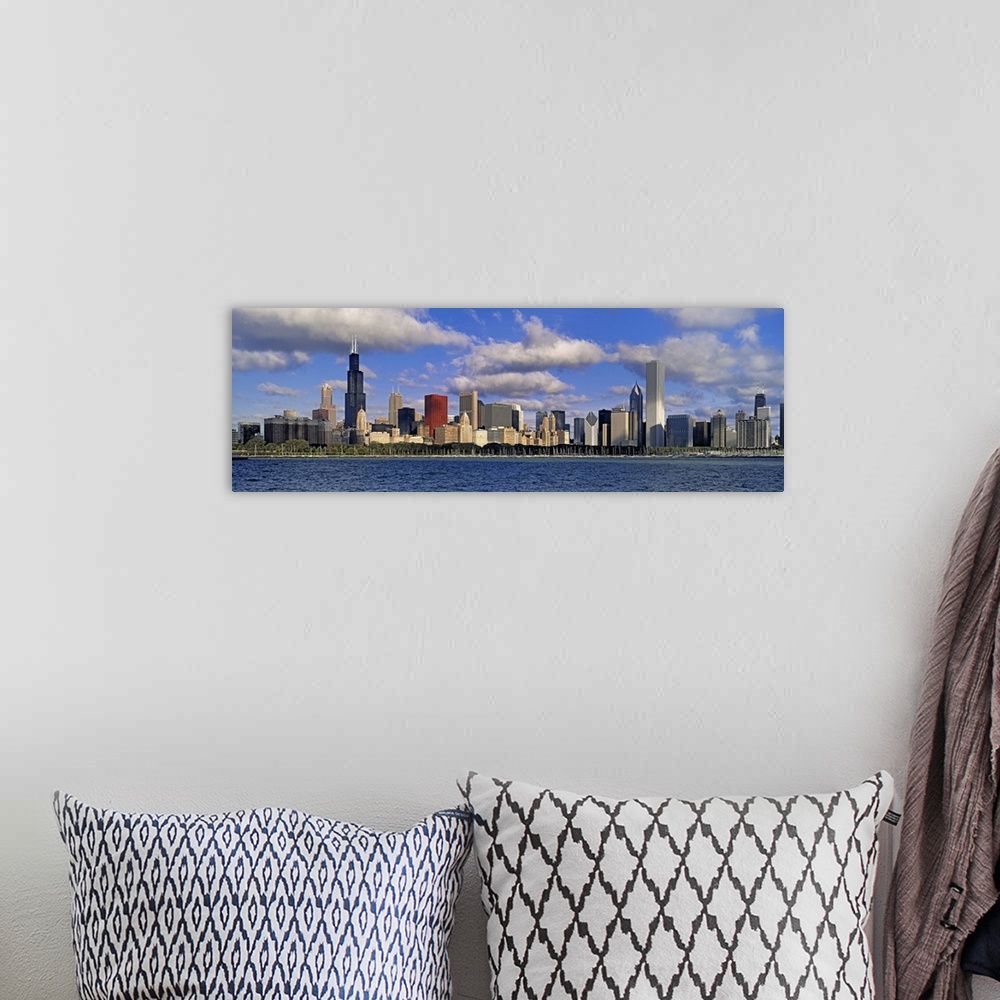 A bohemian room featuring Long panoramic photo print of the Chicago skyline during a bright day by the waterfront.