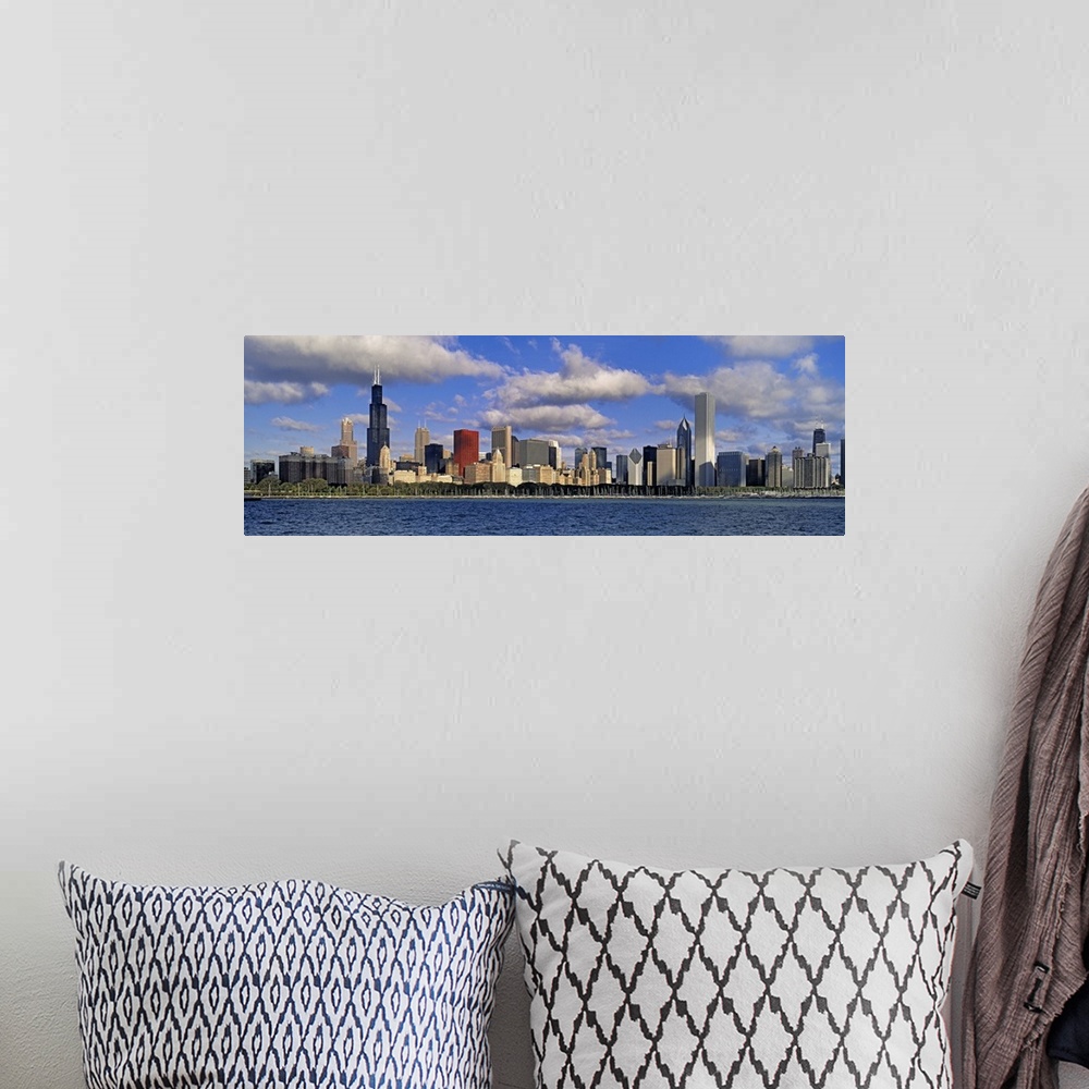 A bohemian room featuring Long panoramic photo print of the Chicago skyline during a bright day by the waterfront.