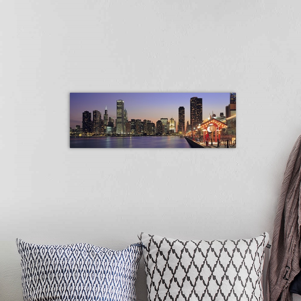 A bohemian room featuring Panoramic cityscape of Chicago at the edge of Lake Michigan at dusk, with the skyscrapers lit up ...