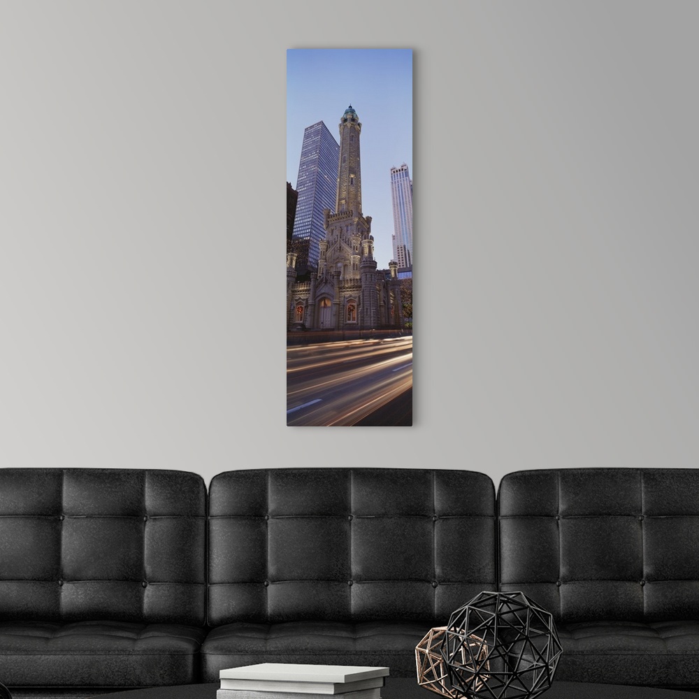 A modern room featuring Vertical panoramic photograph of skyscrapers and tall buildings along city street.