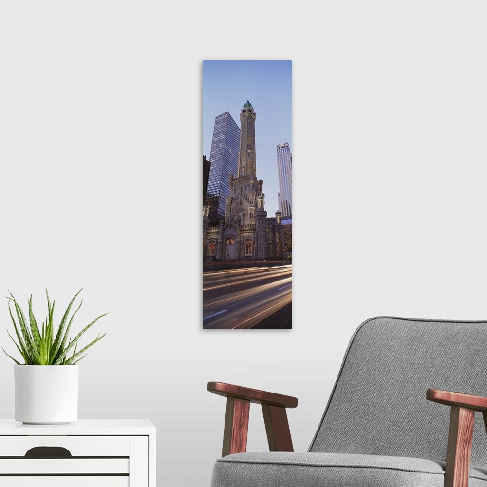 A modern room featuring Vertical panoramic photograph of skyscrapers and tall buildings along city street.