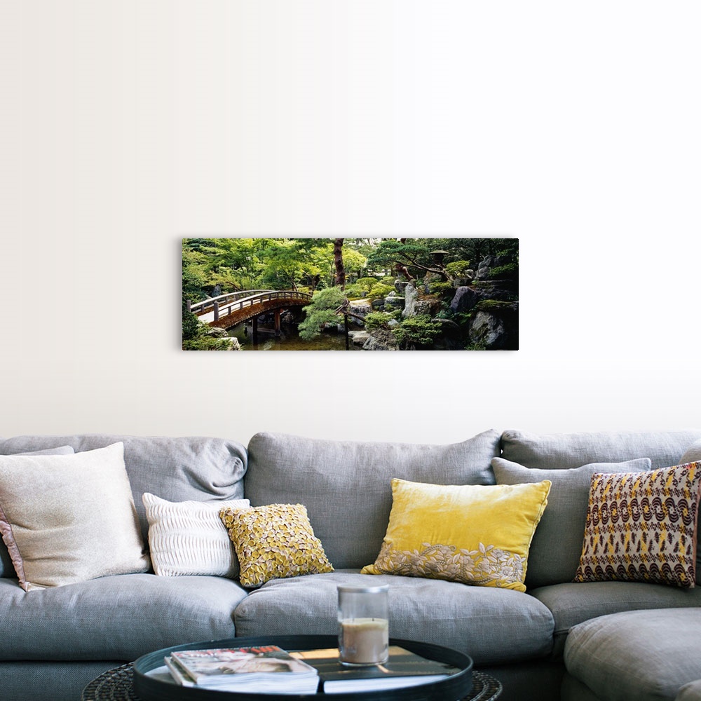 A farmhouse room featuring Panoramic photo on canvas of a bridge leading over a river with a garden on the right.