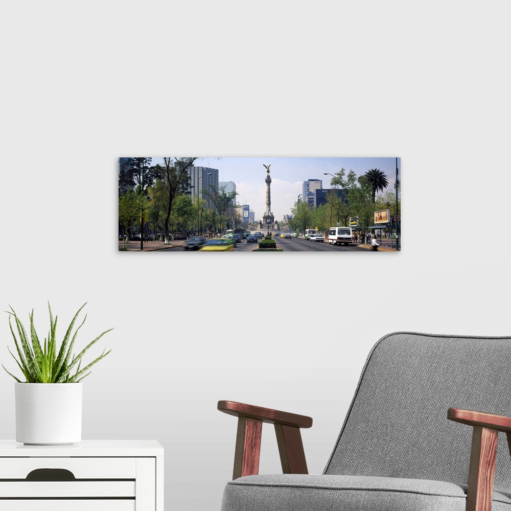 A modern room featuring Traffic on road with victory column, Independence Monument, Independence Circle, Paseso Del La Re...