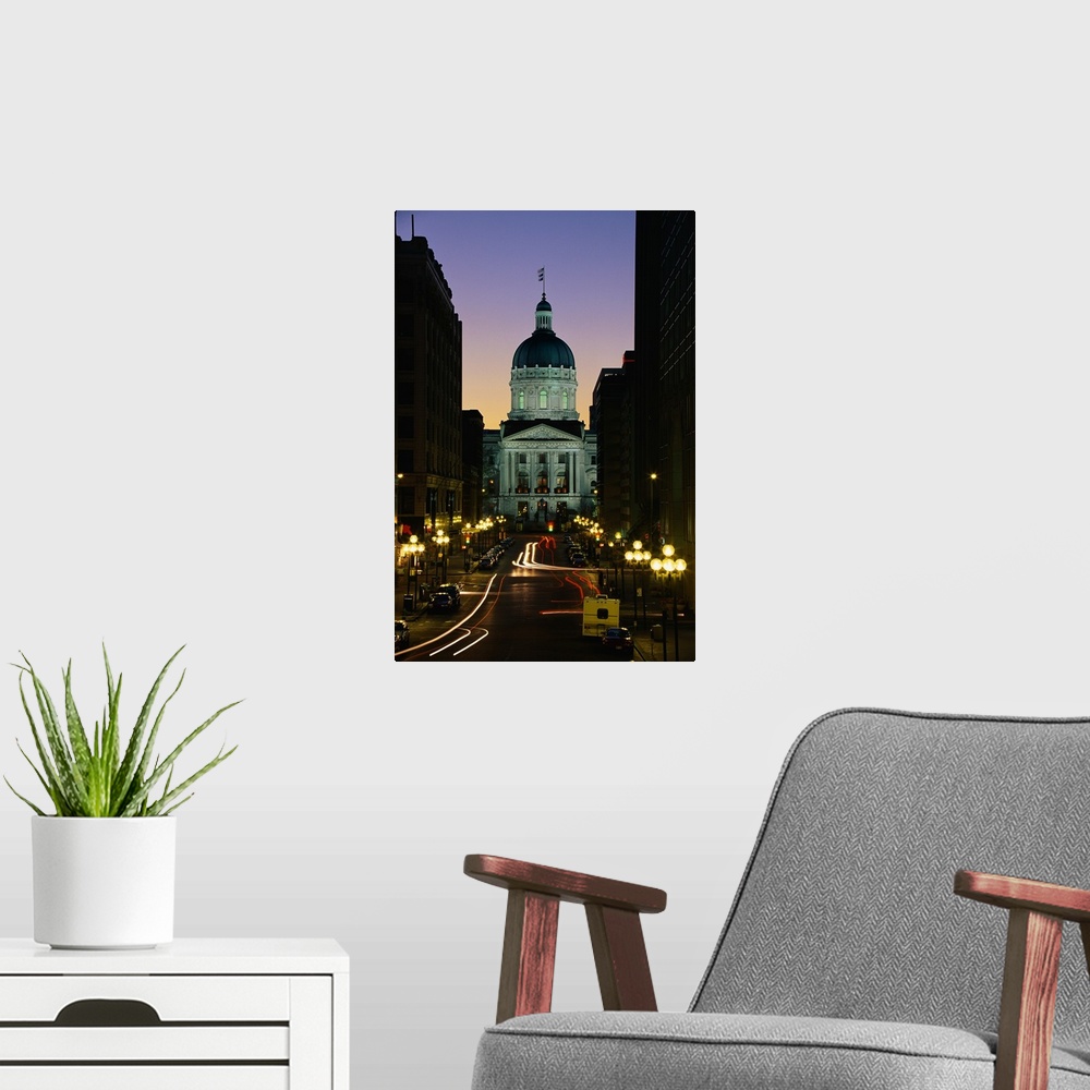A modern room featuring Tall canvas photo art of the Capitol Building in Indiana lit up at dusk seen from the front with ...